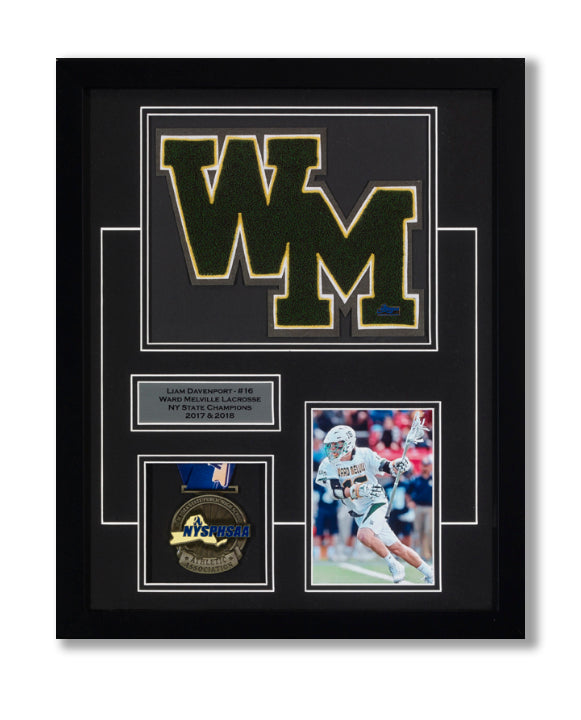 Framed picture featuring medal, varsity letter, picture of lacrosse player, and custom nameplate. 